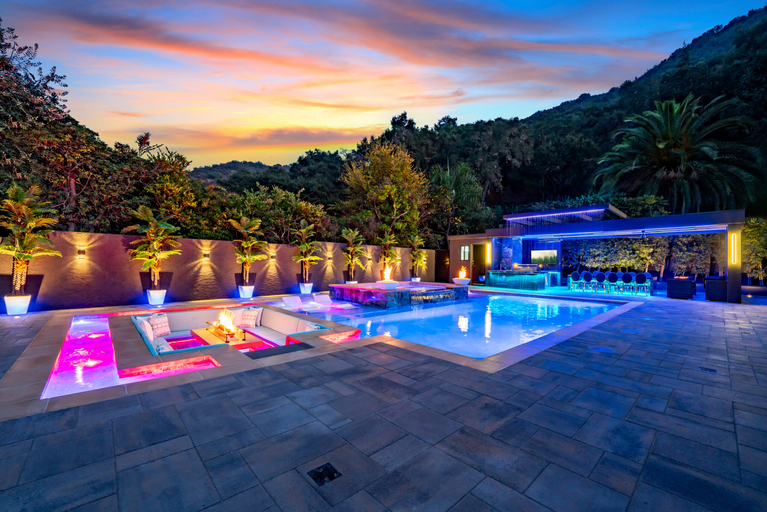 New pool with spa and built-in firepit and waterfall